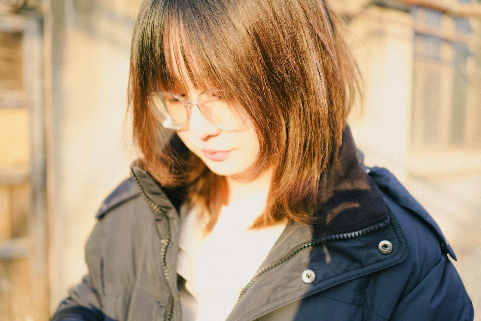 A woman is looking at her cell phone